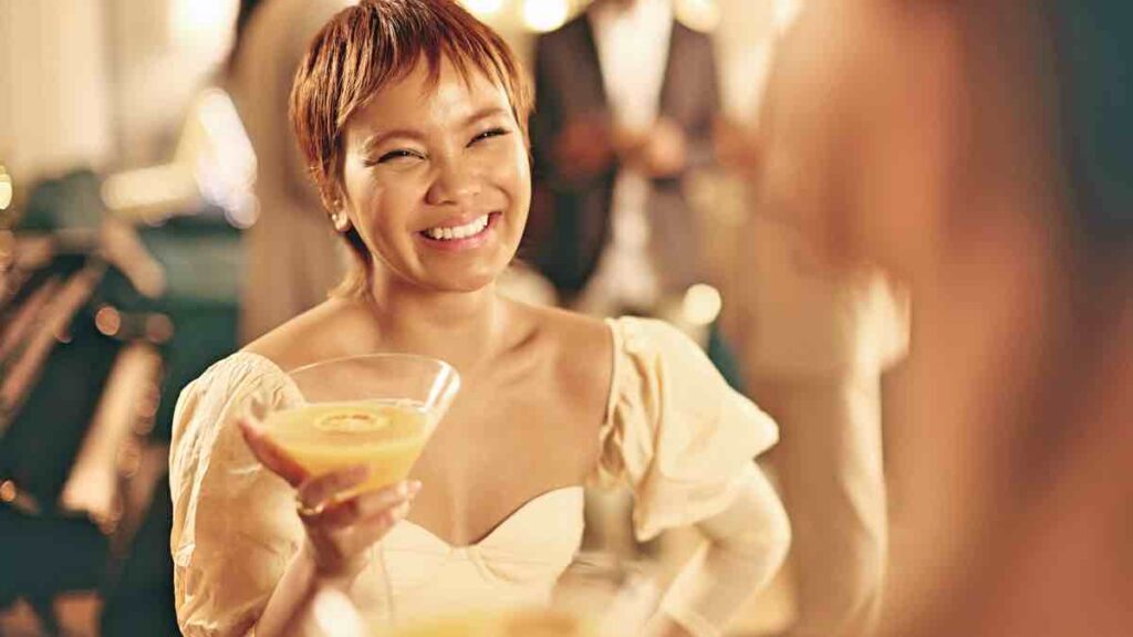 Guest drinking cocktail in a luxury villa