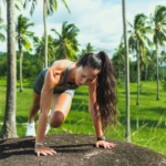 a woman athlete training in a lush garden of a luxury villa in Bali Indonesia