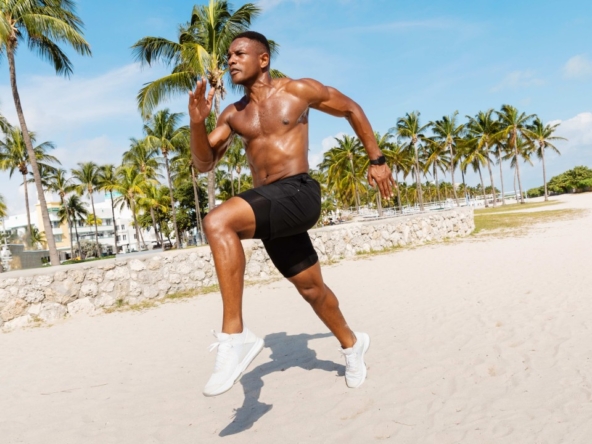 elite sports athlete running on private beach